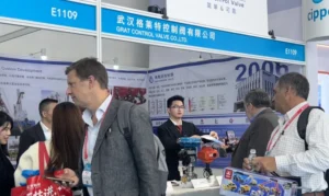 GRAT Control Valve Co., Ltd. booth at the CIPPE exhibition. The image shows our professional team engaging with international clients and demonstrating industrial electric and pneumatic actuators and control valve solutions.